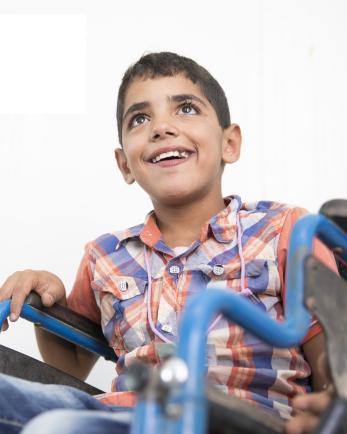 boy in Jordan in a wheelchair